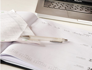 close up photo of note book and pen